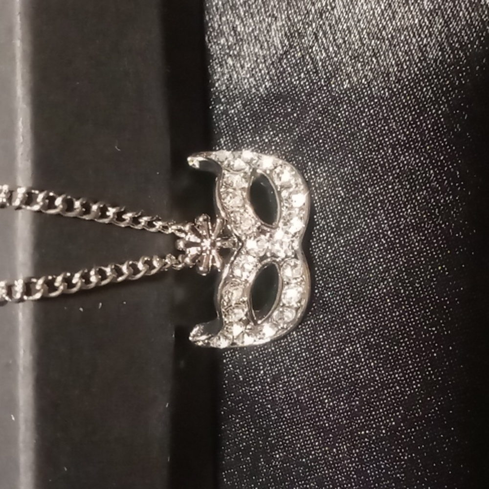 Masquerade charm necklace 18 + 2 inch box chain .
